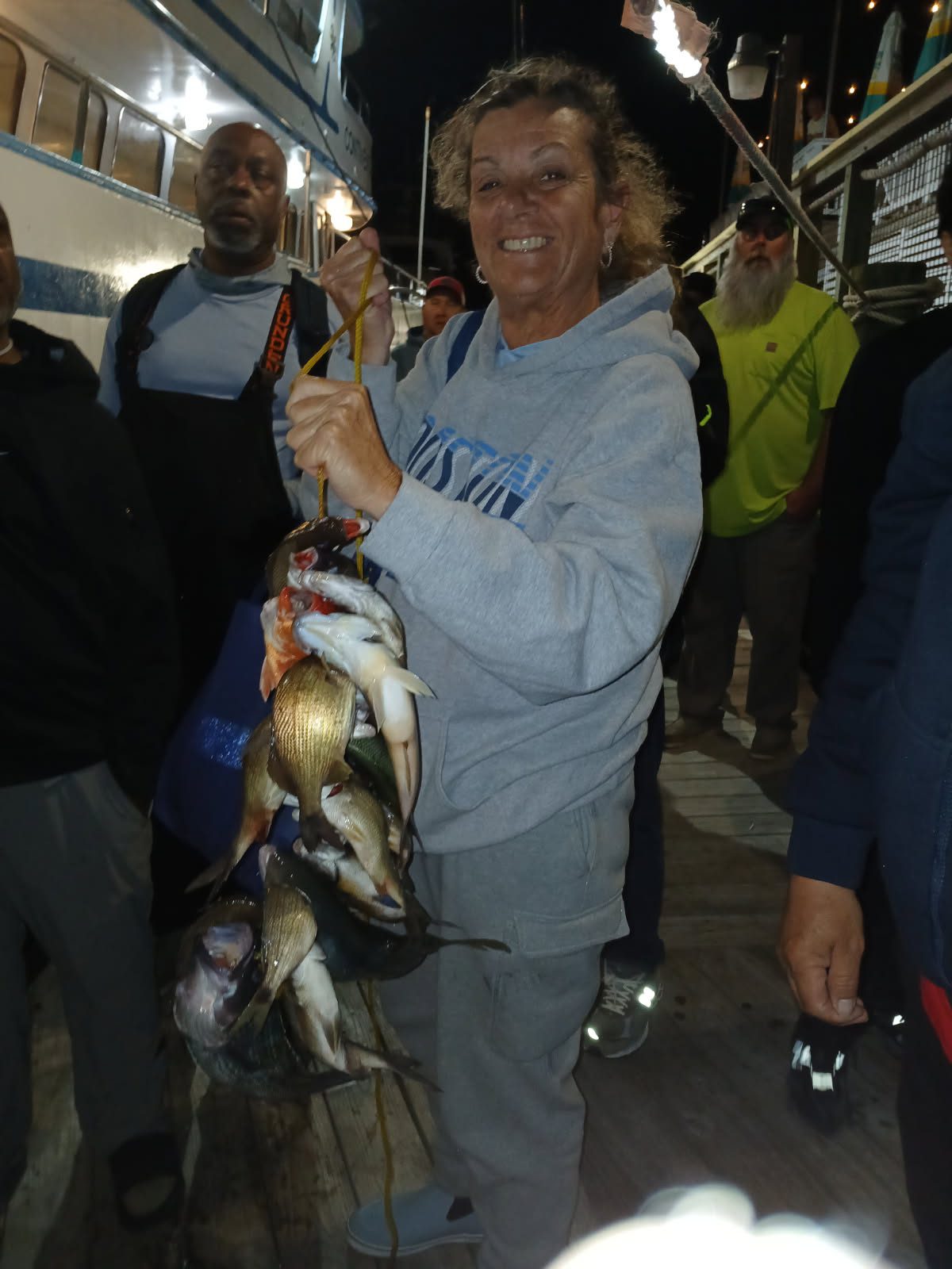 a person holding a fish
