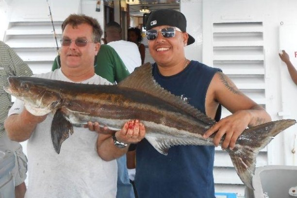 a man holding a fish